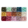 750 farverige bogstavperler i 15 farver med guldtryk, A–Z. Ø7 mm